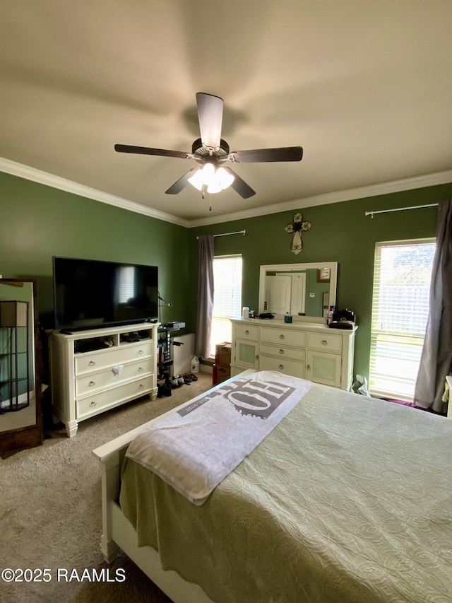 bedroom featuring crown molding, ceiling fan, and carpet floors