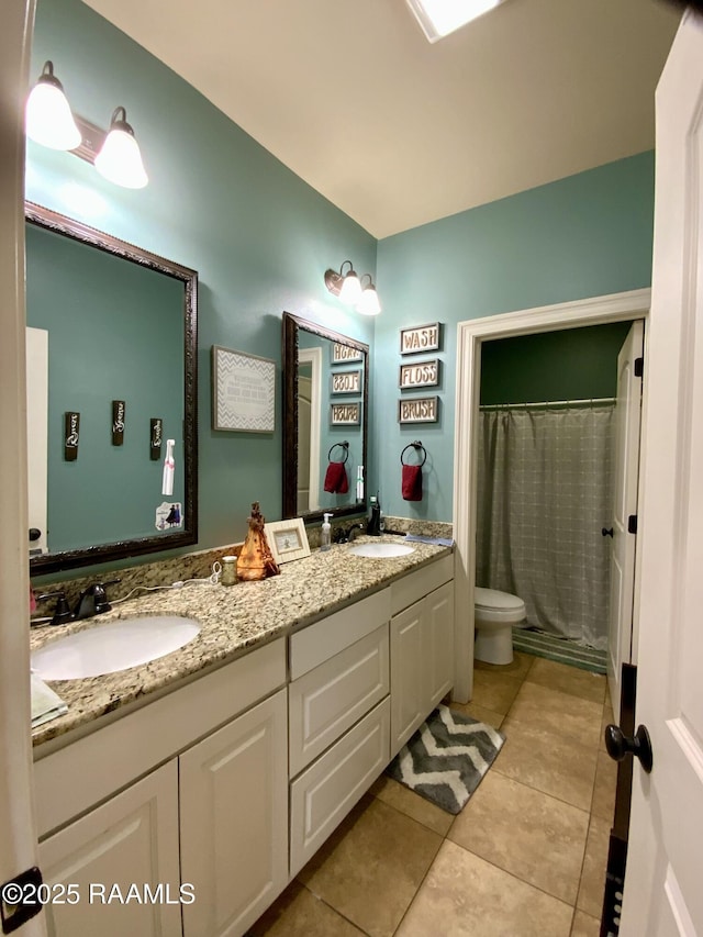 bathroom with vanity, tile patterned flooring, toilet, and a shower with shower curtain