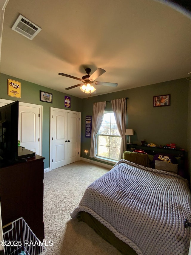 carpeted bedroom with ceiling fan