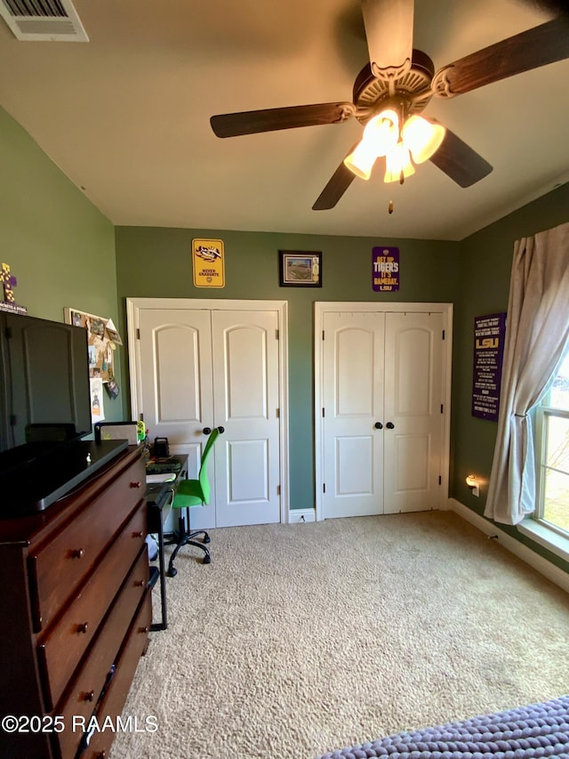 carpeted office featuring ceiling fan