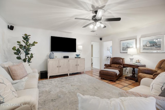 tiled living room featuring ceiling fan