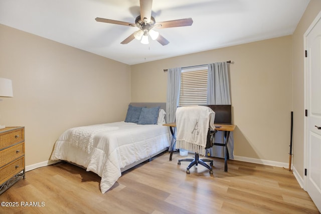 bedroom with ceiling fan and light wood-type flooring