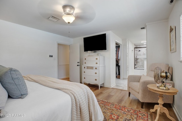 bedroom featuring ceiling fan and light hardwood / wood-style flooring