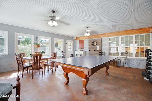 rec room with concrete flooring and ceiling fan