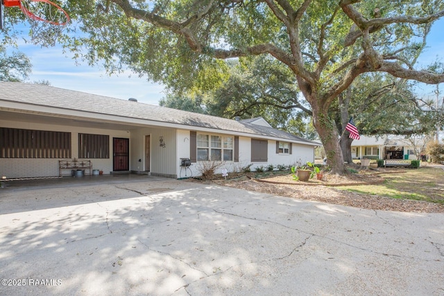 ranch-style house with a carport