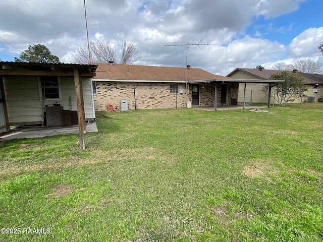 back of house featuring central AC, a patio area, and a lawn