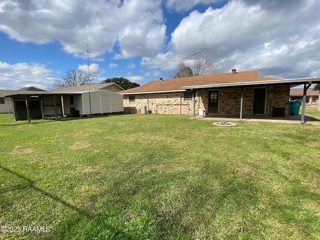 view of yard with a storage shed and a patio area