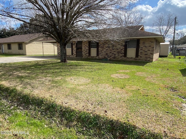 single story home featuring a carport and a front yard