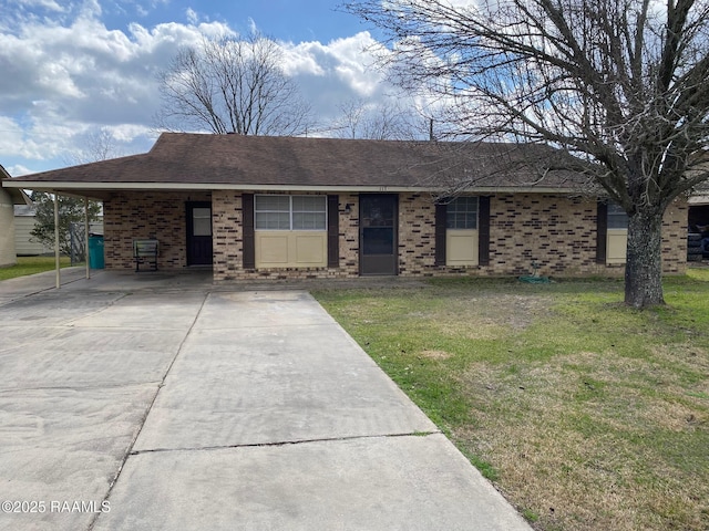 ranch-style home with a carport and a front lawn