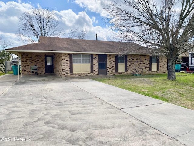 ranch-style house featuring a front yard, brick siding, and roof with shingles