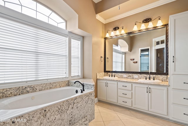 bathroom featuring vanity, tile patterned flooring, a wealth of natural light, and ornamental molding