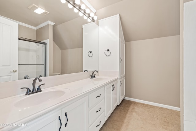 bathroom featuring vanity, vaulted ceiling, and an enclosed shower