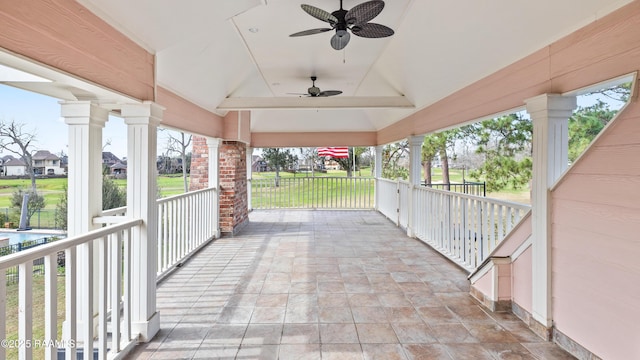 view of patio featuring ceiling fan and a porch