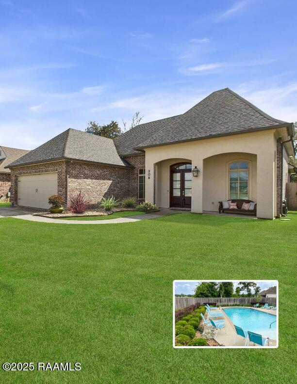 view of front of home with a garage, french doors, roof with shingles, and a front lawn