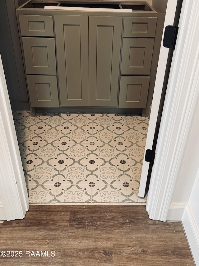 hallway with light hardwood / wood-style floors