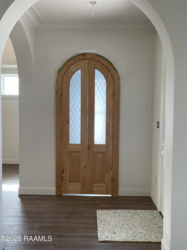 entryway with crown molding and dark hardwood / wood-style floors