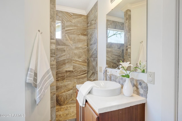 bathroom featuring crown molding and vanity