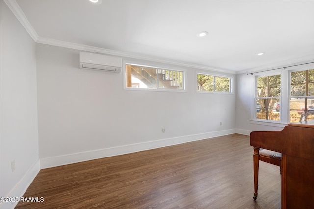 unfurnished room with crown molding, recessed lighting, wood finished floors, a wall mounted air conditioner, and baseboards