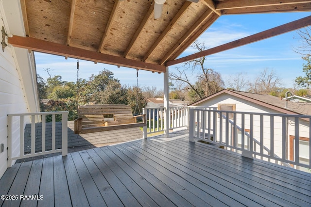 wooden terrace featuring a ceiling fan