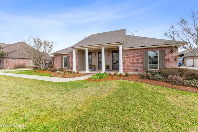 view of front of house with covered porch and a front lawn