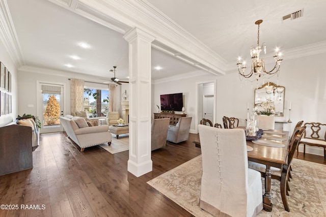 dining area with dark wood-type flooring, ornamental molding, and ornate columns