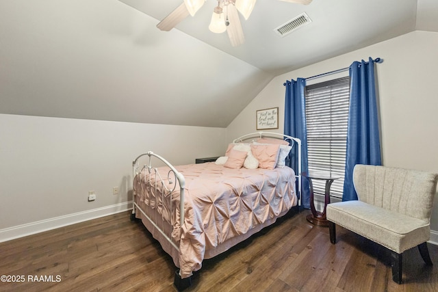 bedroom featuring lofted ceiling, dark wood-type flooring, and ceiling fan