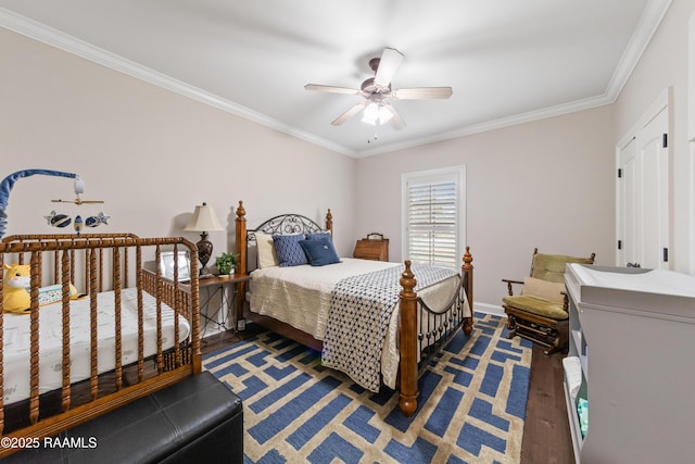 bedroom with ornamental molding and ceiling fan