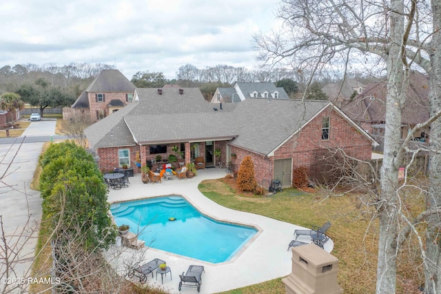 view of swimming pool featuring a patio