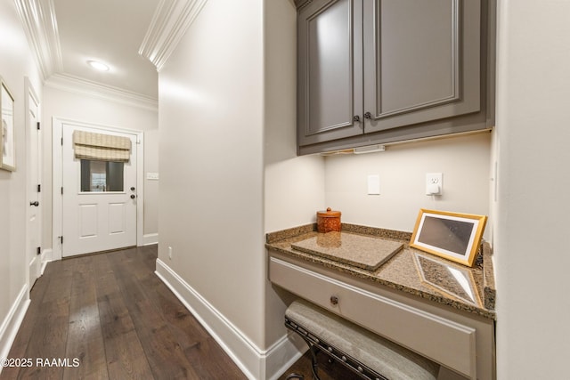 corridor featuring ornamental molding and dark hardwood / wood-style floors