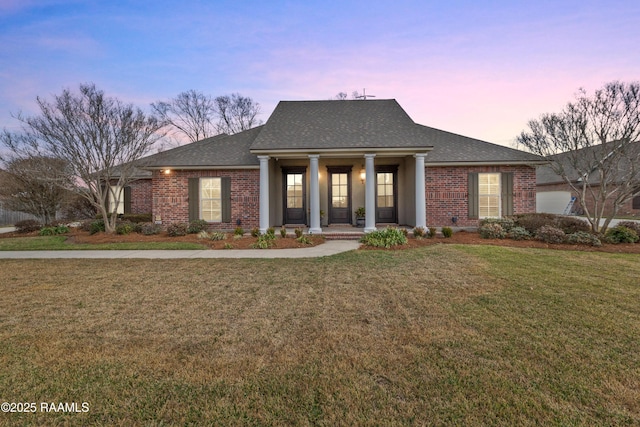 view of front facade featuring a yard and a porch