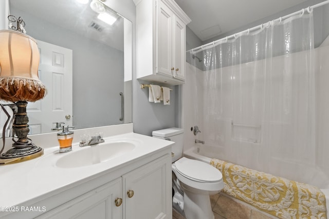 full bathroom with vanity, toilet, tile patterned flooring, and shower / bath combo