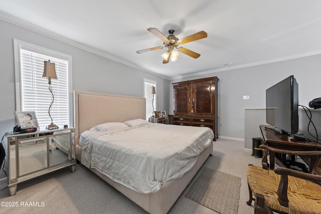 carpeted bedroom featuring crown molding and ceiling fan