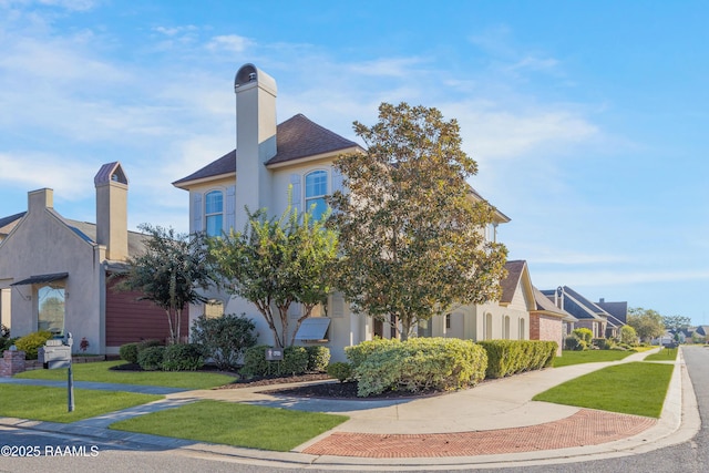 view of front of home with a front lawn