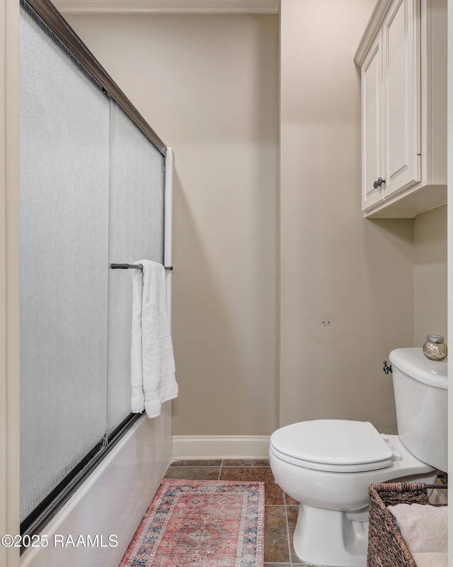 211 Bayonne Dr, Lafayette, LA 70507 - bathroom featuring toilet, baseboards, tile patterned flooring, and an enclosed shower