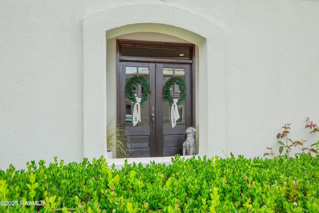 211 Bayonne Dr, Lafayette, LA 70507 - view of exterior entry featuring stucco siding and french doors