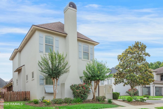 211 Bayonne Dr, Lafayette, LA 70507 - view of front of property with stucco siding and a chimney