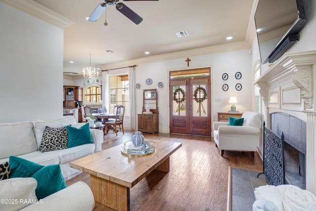 211 Bayonne Dr, Lafayette, LA 70507 - living area featuring a high end fireplace, crown molding, plenty of natural light, ceiling fan, and wood-type flooring