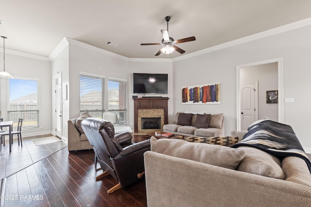 living room with crown molding, dark wood-type flooring, and ceiling fan