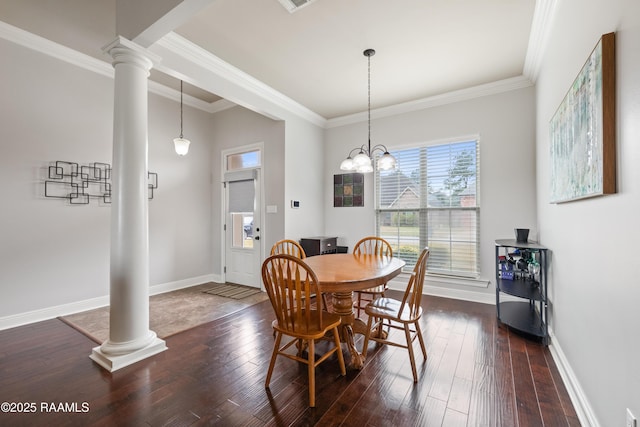 dining room with ornamental molding, dark hardwood / wood-style floors, and ornate columns