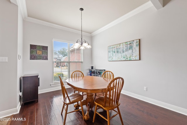 dining area featuring an inviting chandelier, dark wood-type flooring, and ornamental molding