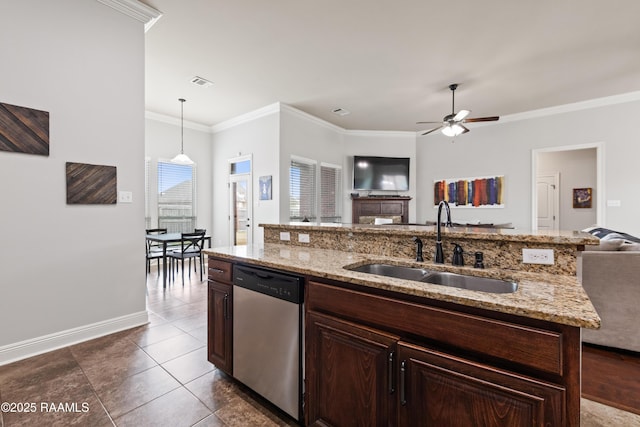 kitchen with decorative light fixtures, sink, ornamental molding, stainless steel dishwasher, and light stone counters