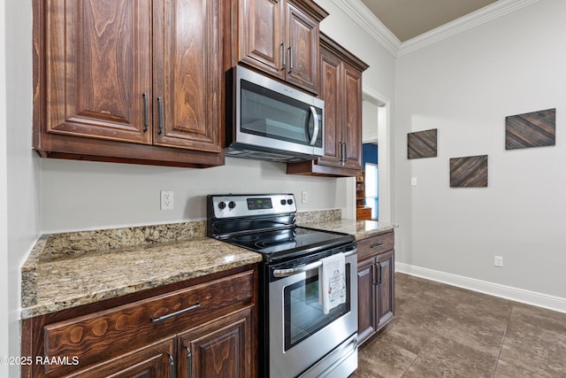 kitchen featuring dark brown cabinetry, light stone counters, crown molding, and appliances with stainless steel finishes