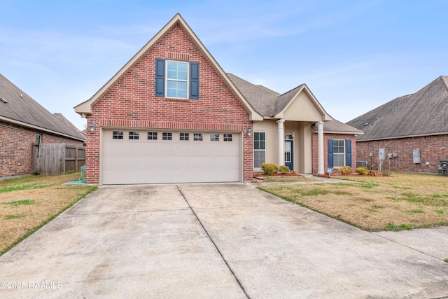 view of front of home featuring a garage and a front lawn