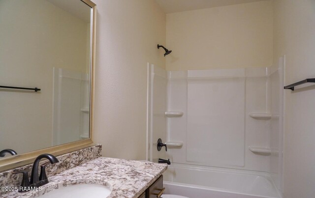 full bathroom with washtub / shower combination, vanity, and toilet