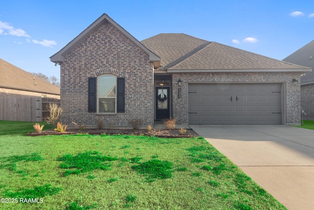 front of property featuring a garage and a front yard