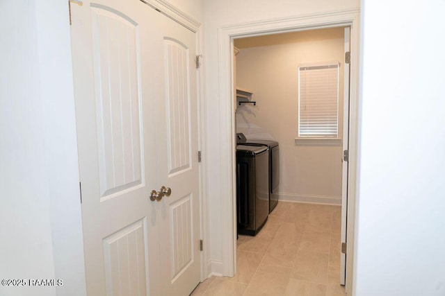 washroom with light tile patterned flooring and independent washer and dryer