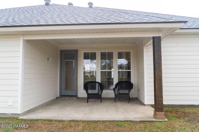 property entrance featuring a patio area
