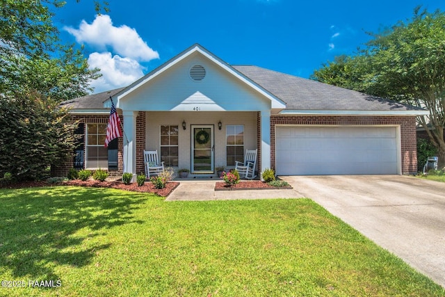 view of front of home with brick siding, a front lawn, covered porch, a garage, and driveway