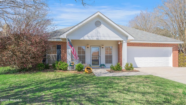 view of front of home featuring driveway, brick siding, an attached garage, and a front lawn