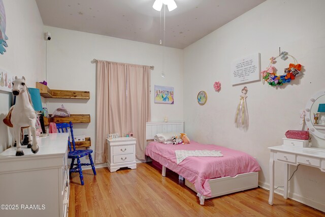 bedroom featuring light wood finished floors